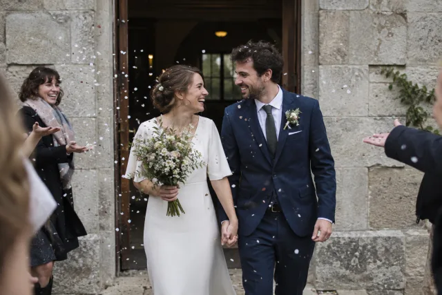 Newlyweds leaving their ceremony